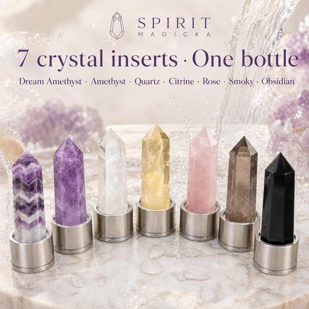 Seven crystal inserts in a row on marble: dream amethyst, amethyst, clear quartz, citrine, rose quartz, smoky quartz and obsidian, each set in a steel base