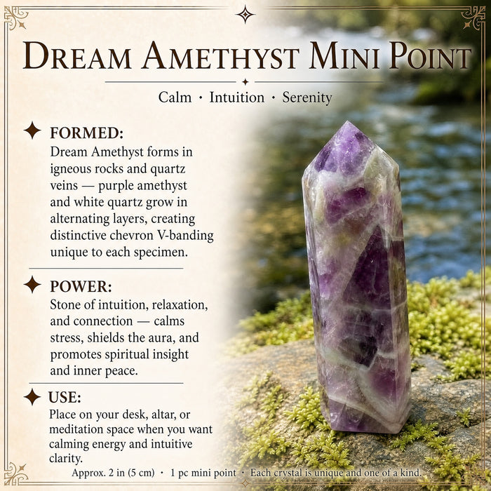 A dream amethyst mini point with purple and white chevron banding on a mossy rock