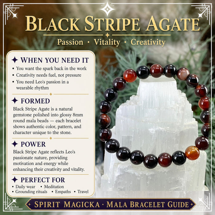 Black stripe agate bracelet of black, deep red and amber banded beads on a selenite tower