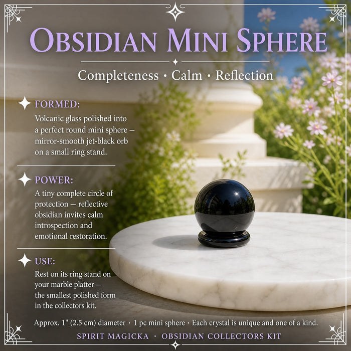 Small round obsidian sphere with a mirror shine on a white marble platter