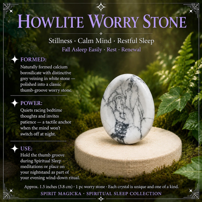 White howlite worry stone with grey veining and a thumb groove