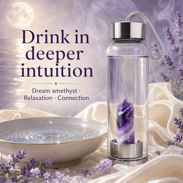 Water bottle with a banded dream amethyst point insert beside a bowl of water and lavender