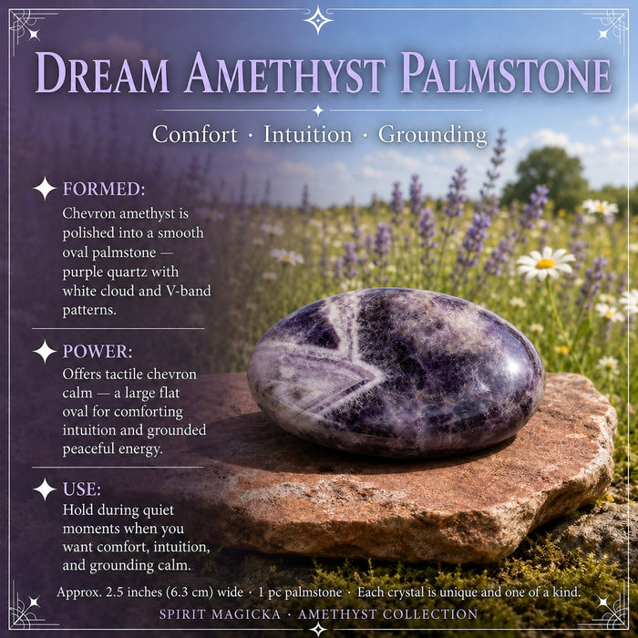 A smooth oval dream amethyst palm stone resting on a stone