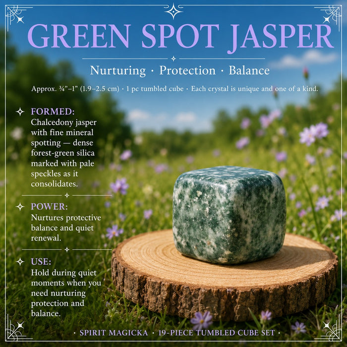 Green Spot Jasper tumbled cube on a wooden round in a wildflower meadow
