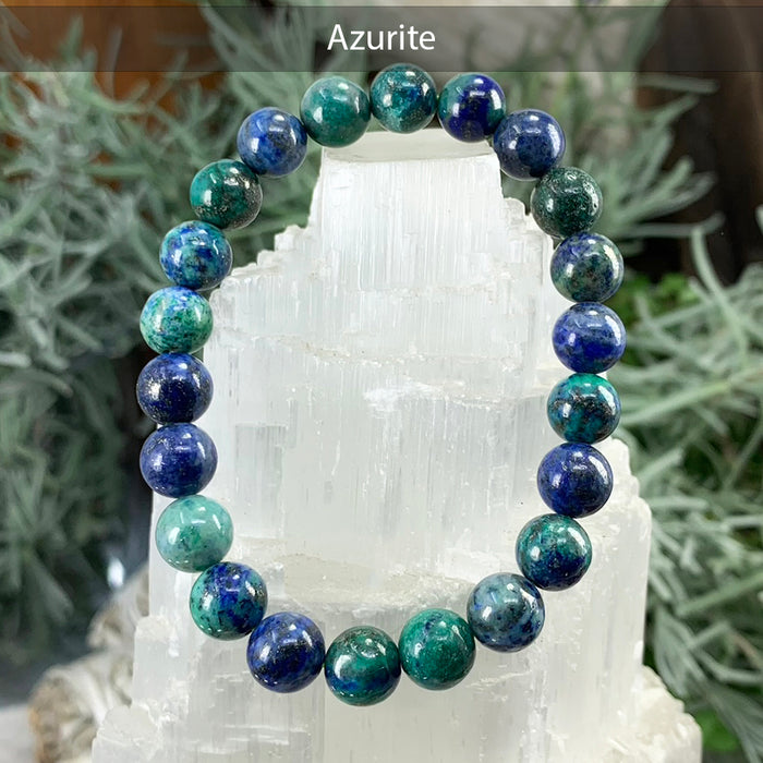 Azurite bead bracelet in deep blue and green on a selenite tower