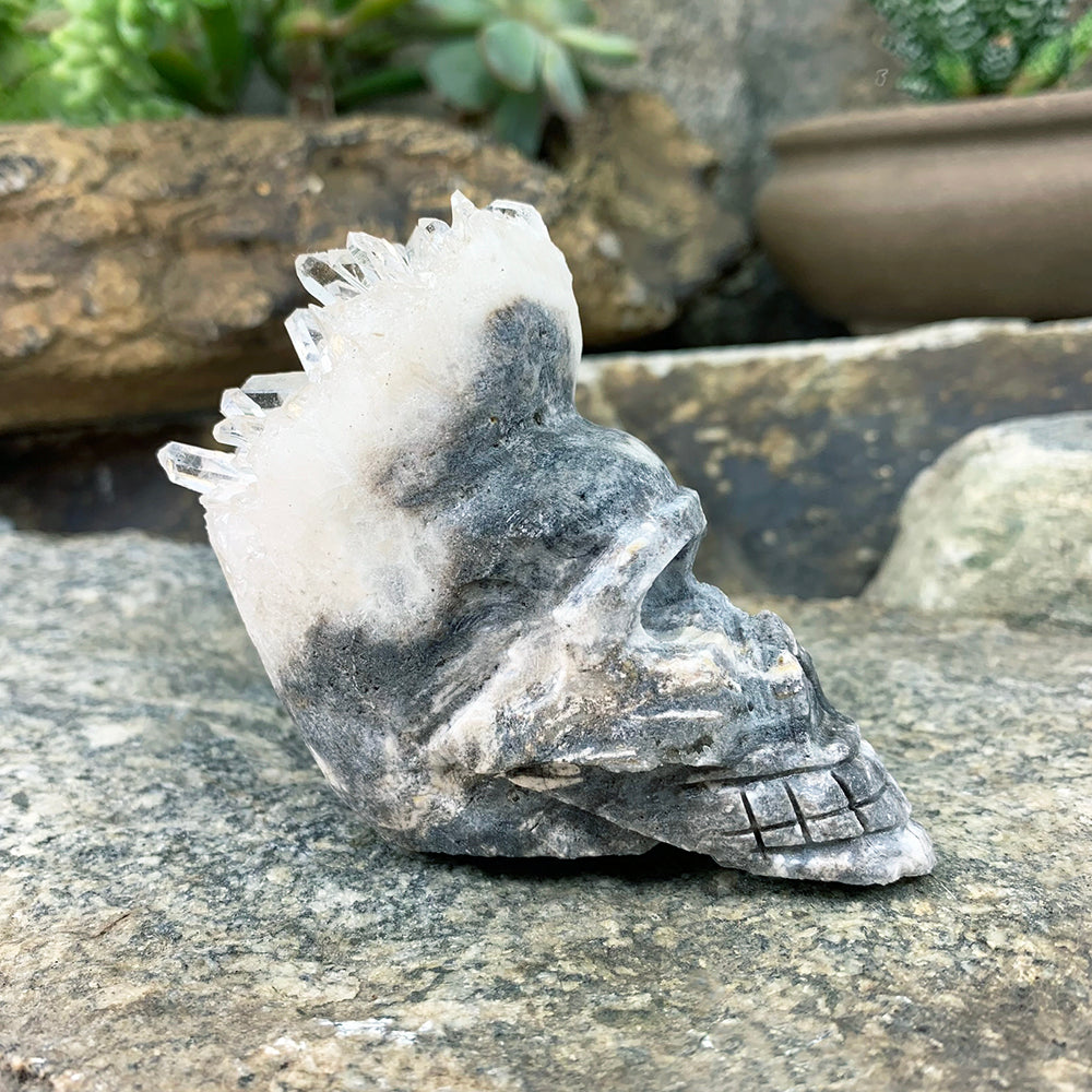 Side profile of the crystal shard skull, showing clear crystal points sweeping back from the brow to the crown