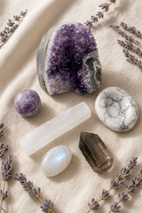 Spiritual Sleep crystal kit on cream linen with the Geode Freeform amethyst as centerpiece, plus lepidolite, howlite, selenite, moonstone, and smoky quartz.