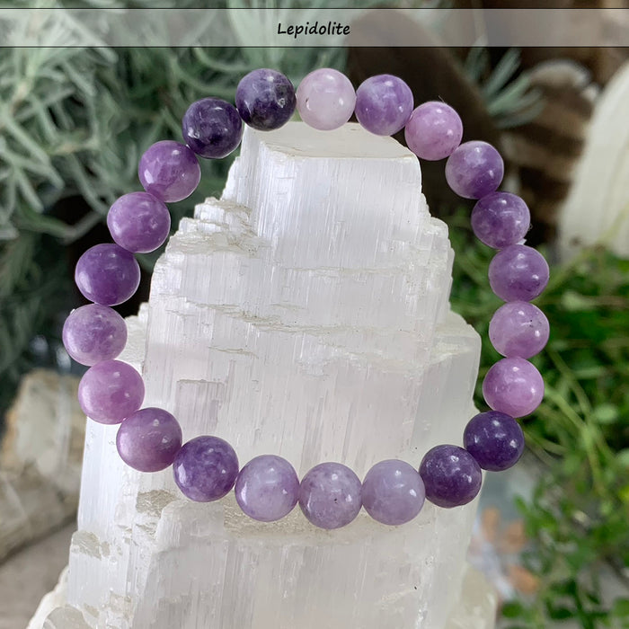 Lavender lepidolite bead bracelet on a selenite tower