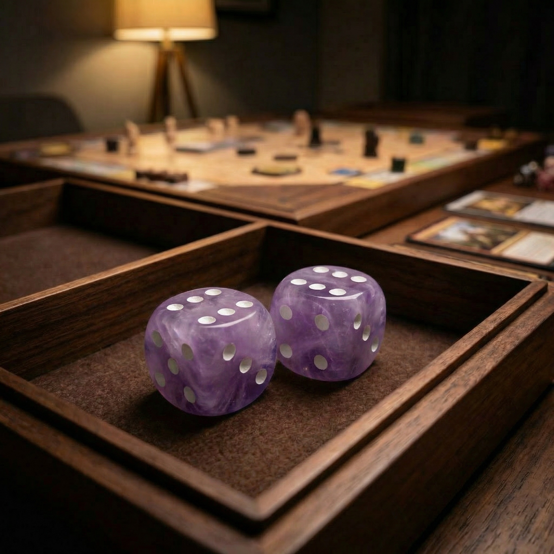 The two amethyst dice rolled into a wooden dice tray by lamplight