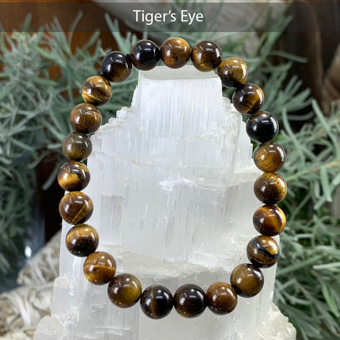 Tiger eye bead bracelet on a selenite tower